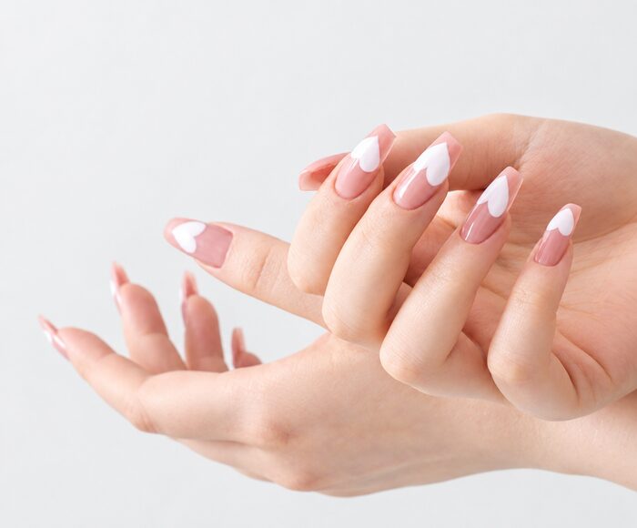 Delicate white French tips on a pale pink base