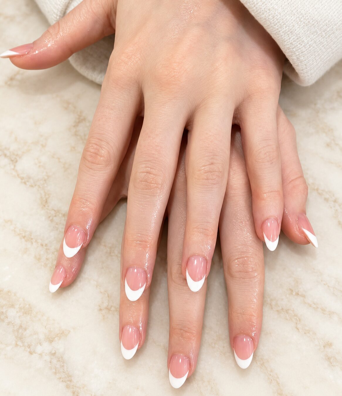 Short almond nails with a crisp white French tip
